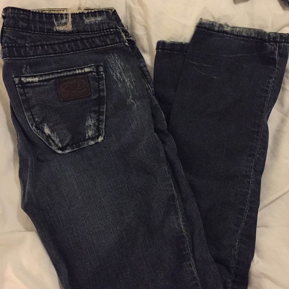 Stitch’s dark worn in jeans
